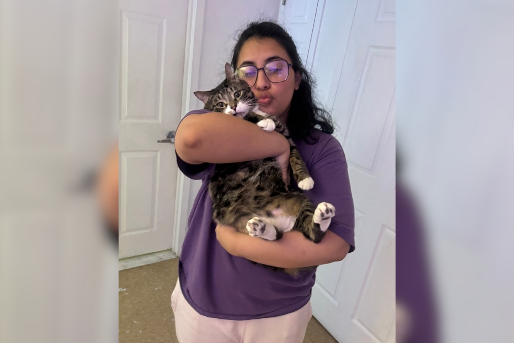 Adopter holding her cat