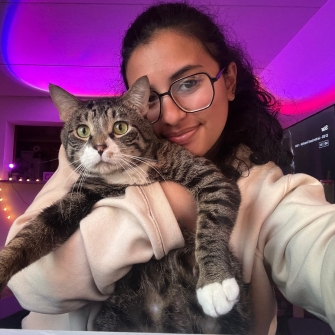 Adopter holding her cat