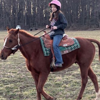 Girl riding horse